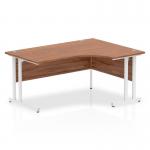The desk has a sleek design with a walnut top and white cantilever legs. It has a unique right crescent shape that adds a dynamic element. The desk is 1600mm in length and perfect for an office space.