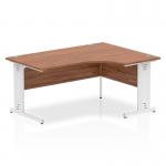 This photo features a dynamic corner desk with a 1600mm right crescent shape. The desk has a walnut top and cable managed legs in white, giving it a sleek and professional appearance. The mix of natural wood and modern design creates a stylish and functional workspace.