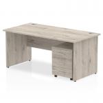 The photograph shows a sleek and modern Dynamic Pedestal Desk in grey oak finish, measuring 1600 x 800mm. The straight office desk is supported by panel end legs and comes with a 3 drawer mobile pedestal for added storage. This workstation exudes a professional and dynamic vibe.