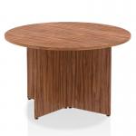 The photo captures the sleek design of the Dynamic Round Tables Impulse 1200mm Round Table. The walnut top adds a touch of warmth, while the unique arrowhead legs give off a modern and dynamic vibe. This table is sure to make a statement in any space.