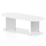 In this image, a sleek and modern dynamic boardroom is set up with an Impulse 2400mm boardroom table featuring a white top and arrowhead leg design. The clean lines and professional aesthetics of the table complete the stylish and functional space.