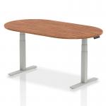 This photo captures a modern and stylish boardroom with an Impulse 1800mm walnut table and adjustable silver legs. The dynamic atmosphere is enhanced by the conference tables, adding functionality and elegance to the space.