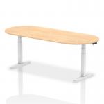 This photo captures a sleek and modern boardroom and conference table with a dynamic design. The Impulse 2400mm table features a stunning maple top and sleek white height-adjustable legs, creating a professional and stylish workspace.