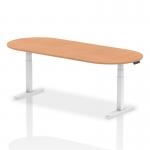 This photograph captures a modern and versatile boardroom and conference setup. The Dynamic Impulse 2400mm table, with a sleek oak top and adjustable white legs, exudes sophistication and functionality. It is surrounded by comfortable chairs, creating an environment perfect for productive meetings and presentations.