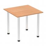 This photo shows a sleek and modern Dynamic Tables Impulse 800mm Square Table, featuring an oak top and chrome post leg. The table is expertly crafted and designed to bring a dynamic and modern touch to any space.