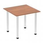 This picture features a sleek 800mm square table with a walnut top and chrome post leg. The tables has a dynamic design that adds a modern touch to any space.