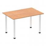 In this image, we see a 1200mm straight table with an oak top resting on chrome post legs. The tables give off a sense of movement and energy, with a sleek and modern aesthetic. The chrome legs provide a sturdy base for the table, while the oak top adds a touch of warmth and natural beauty.