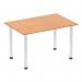 In this image, we see a 1200mm straight table with an oak top resting on chrome post legs. The tables give off a sense of movement and energy, with a sleek and modern aesthetic. The chrome legs provide a sturdy base for the table, while the oak top adds a touch of warmth and natural beauty.