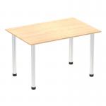 This photograph features a sleek and modern Dynamic Tables Impulse 1200mm Straight Table with a glossy maple top and shiny chrome post legs. The table exudes a professional and dynamic feel, perfect for any contemporary workspace.