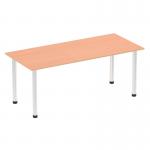 The image shows a modern and sturdy beech top table with chrome post legs. The straight table measures 1800mm and has a dynamic and streamlined design. The sleek finish and clean lines make it a versatile addition to any space.