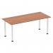 In the photo, a 1800mm straight table with a walnut top and chrome post leg is seen. The table has a sleek and modern design, with a dynamic and versatile feel. The walnut adds warmth and character, while the chrome post leg adds a touch of sophistication. This table is the perfect addition to any modern workspace.