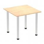 This photo showcases a sleek and modern Dynamic Tables Impulse 800mm Square Table. The table features a maple top and a brushed aluminium post leg, creating a stylish and functional piece for any space.