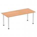 In this photograph, we see a sleek and modern Dynamic Tables Impulse 1800mm Straight Table. The top is made of oak with a brushed aluminium post leg, creating a polished and professional look. The table appears sturdy and spacious, offering plenty of room for working or collaborating.
