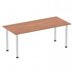 The image features a sleek 1800mm straight table with a walnut top and a brushed aluminium post leg. The table appears to have a dynamic design, perfect for modern office spaces.