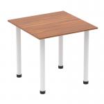 This picture features a sleek and modern Dynamic Tables Impulse 800mm square table with a walnut top and white post legs. It exudes a professional and stylish vibe, perfect for any modern office or meeting space. The clean lines and contrasting colors add sophistication to the overall look.