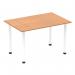 This picture showcases a Dynamic Tables Impulse 1200mm straight table with an oak top and white post legs. The table exudes a modern and sleek design, perfect for any office or workspace. The oak top adds a touch of warmth, while the white post legs give it a clean and crisp look.