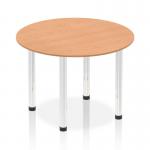This image shows a dynamic round table with a 1000mm oak top and chrome post legs. The table has a sleek and modern design, with a sturdy and polished appearance. It is suitable for a variety of settings, from a conference room to a modern dining area. The round shape invites conversation and collaboration.