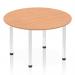 This photograph captures a stylish and modern dynamic round table with a sleek oak top and chrome post leg. The 1200mm round shape creates a versatile and inviting setting for any space.
