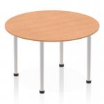 This picture features a 1200mm round table with an oak top and a brushed aluminium post leg. The dynamic design of the table brings a modern touch to any space. The warm tones of the oak top and the sleek finish of the aluminium leg make it a stylish addition to any room.