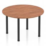 This image features a sleek and modern Dynamic Round Tables Impulse 1200mm round table with a rich walnut top and black post leg. The table exudes a sense of elegance and sophistication, making it a versatile and stylish addition to any space. The smooth round shape adds a dynamic element to any room, while the sturdy post leg provides stability and support.