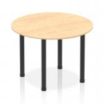 This photo showcases a dynamic round table featuring a 1000mm maple top and black post leg design. The round shape and neutral color scheme creates a sleek and modern look.