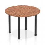 The photograph captures a sleek and modern dynamic round table, measuring 1000mm in diameter, with a warm walnut top and striking black post legs. It exudes a sense of innovation and sophistication, making it a perfect addition to any modern workspace.