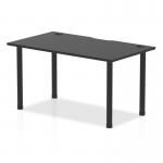 The photo shows a sleek Dynamic Tables Impulse Black Series table measuring 1400 x 800mm with a black top, cable ports, and black post legs. Its modern design exudes sophistication and is perfect for any contemporary workspace.