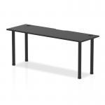 The image shows a sleek and modern black table with a straight surface measuring 1800 x 600mm. The table has cable ports and is supported by black post legs, making it perfect for any dynamic and organized workspace.