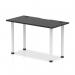 In this photo, the Dynamic Tables Impulse Black Series table is shown with a sleek black top and white legs. The 1200 x 600mm straight design allows for versatile placement in any space. Cable ports are visible for easy wire management.