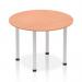 This photo features a stylish round table with a beech top and silver post leg. Its dynamic design is perfect for modern spaces and adds a touch of sophistication.