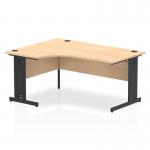 This photograph showcases a dynamic left hand desk, perfect for any modern office. The Impulse desk features a 1600mm maple top, complemented by a black cable managed leg. The left crescent shape adds a unique touch, creating a functional and stylish workspace.