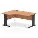 In the photo, the dynamic left hand desk appears as a sleek and modern piece of office furniture. The oak top and black cable managed leg offer a sophisticated contrast, while the curved left crescent shape adds visual interest. The desk is organized and ready for productivity.