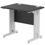 This photograph features a sleek black top with silver cable managed legs. The dynamic cable management allows for a clean and organized workspace.