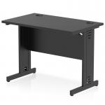 The photo showcases a sleek and modern black office desk with cable management features. The desks surface measures 1000 x 600mm and the legs also have built-in cable management systems. This creates a tidy and organized workspace for improved productivity.