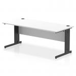 The photograph shows a sleek and modern white desktop measuring 1800 x 800mm, with a black cable managed leg. The cables are neatly organized and hidden, creating a clutter-free workspace. The design of the desk exudes versatility and functionality.