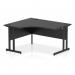 This photograph captures a sleek and modern office desk with a curved left side, featuring a black top and cantilever leg. The dynamic design adds a touch of style to any workspace.