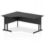 In the photo, a sleek and modern Impulse 1600mm left crescent office desk is shown. Its black top and matching cantilever leg create a contemporary look. The dynamic shape of the desk allows for maximum workspace and ergonomic comfort.