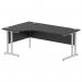 In this photo, we see a modern and functional office desk. The desk features a sleek black top with a smooth curved shape on the left side, giving it a dynamic and contemporary look. The silver cantilever leg adds stability and style. This desk would be a great addition to any professional workspace.