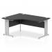 The picture shows a sleek and modern Dynamic Left Hand Impulse 1600mm Desk in black with a silver cable managed leg, featuring a crescent-shaped left portion for added workspace. The desk exudes style and functionality for any office setting.