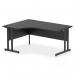 The image shows a sleek and modern Dynamic Right Hand Desks Impulse 1600mm Right Crescent Office Desk. It features a black top and black cantilever leg, giving off a professional and sophisticated look. This desk is perfect for any modern office setting.