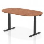 In the photo, the dynamic boardroom and conference tables offer a sleek design with an Impulse 1800mm walnut top. The black height adjustable leg adds versatility, making it suitable for any modern office space.