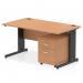 The photo shows a sleek and modern dynamic pedestal desk. The desk features a 1400 x 800mm straight oak top, with a black cable managed leg to keep cords organized. A 2 drawer mobile pedestal is also included for convenient storage.