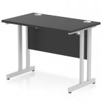The photograph showcases a sleek and modern black rectangular desk with silver cantilever legs. The desk measures 1000 x 600mm and exudes a sense of energy with its dynamic design. It would make a stylish addition to any office space.