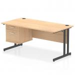 At the center of the image is a sleek, maple top desk with a black cantilever leg base. A fixed pedestal with two drawers is situated on one side, providing storage. This dynamic pedestal desk is perfect for a modern office setting.