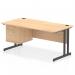 At the center of the image is a sleek, maple top desk with a black cantilever leg base. A fixed pedestal with two drawers is situated on one side, providing storage. This dynamic pedestal desk is perfect for a modern office setting.