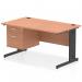 This photograph shows a sleek and modern Dynamic Pedestal Desk Impulse, with a 1400 x 800mm straight beech top and black cable managed legs. A 2 drawer fixed pedestal is attached to provide storage space. The desk is professional and functional, perfect for any office space.