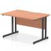 This photograph showcases a set of dynamic rectangular desks, each measuring 1200 x 800mm. The scalloped edge design adds a touch of elegance to the beech top, offset by the sleek black cantilever legs. Ideal for a modern office space.