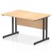 This photo shows a modern office desk with a rectangle shape and scalloped edge. The desk has a maple top and black cantilever legs and measures 1200 x 800mm. It has a dynamic and sleek design, making it a great addition to any professional workspace.
