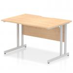 This photograph shows a sleek and modern office desk in the Impulse style. The desk has a rectangular shape with a scalloped edge and is made of maple wood. It has a silver cantilever leg for support and measures 1200 x 800mm. The overall design is dynamic and professional, perfect for any office space.
