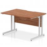 The dynamic rectangle desk is 1200 x 800mm with a scalloped edge design, featuring a straight office desk with a walnut top and silver cantilever leg. The desk exudes a modern and sleek appearance with its unique scalloped edge and contrasting silver leg. It is spacious enough for all your office needs while adding a touch of elegance to your workspace.
